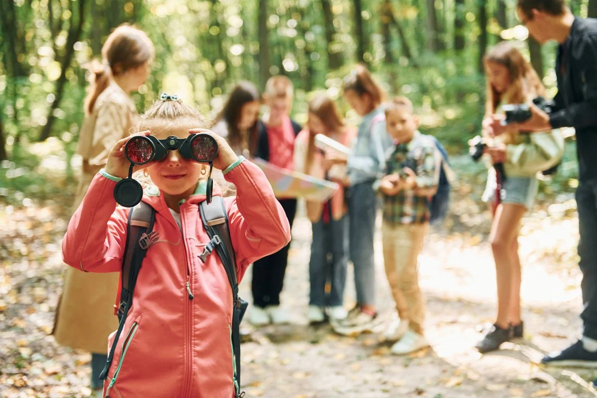 Girl Looking Into Binoculars Kids Green Forest Summer Daytime Together