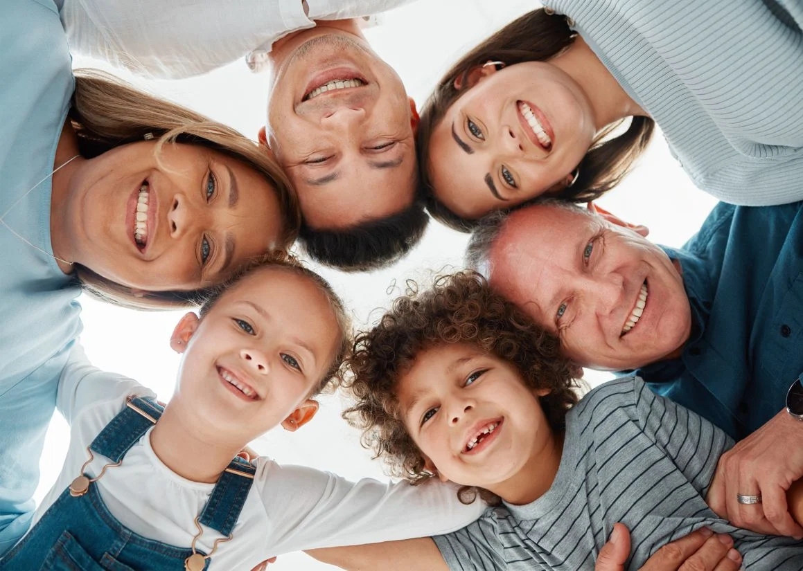 Happy Family Portrait With Hug Huddle Bonding Weekend Holiday Together Low Angle Parents Grandparents With Children Kids Smile Unity Solidarity Love Support