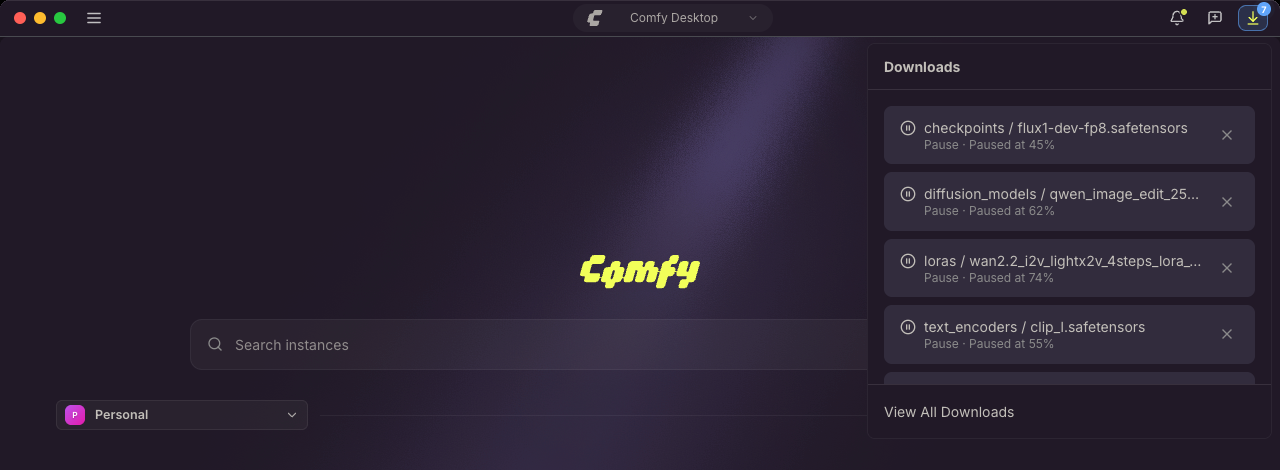Bandeja de Descargas abierta desde la barra de título de Comfy Desktop, con las descargas de modelos listadas junto a su carpeta y su progreso