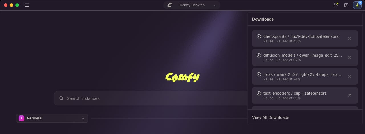 Bandeja de Descargas abierta desde la barra de título de Comfy Desktop, con las descargas de modelos listadas junto a su carpeta y su progreso