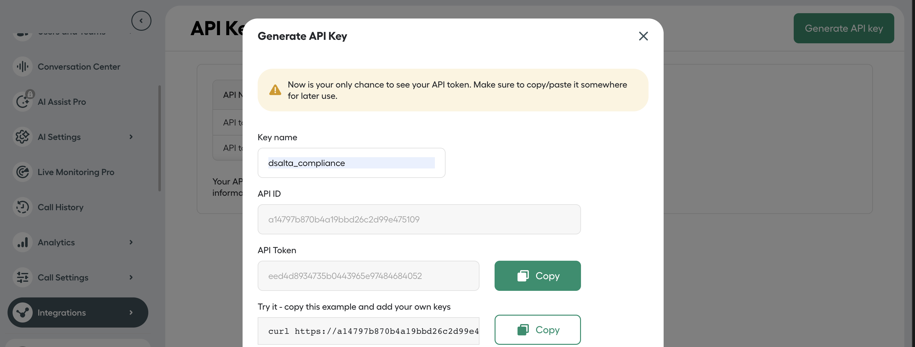 Aircall's Generate API Key dialog showing the key name, API ID and API Token with a copy button