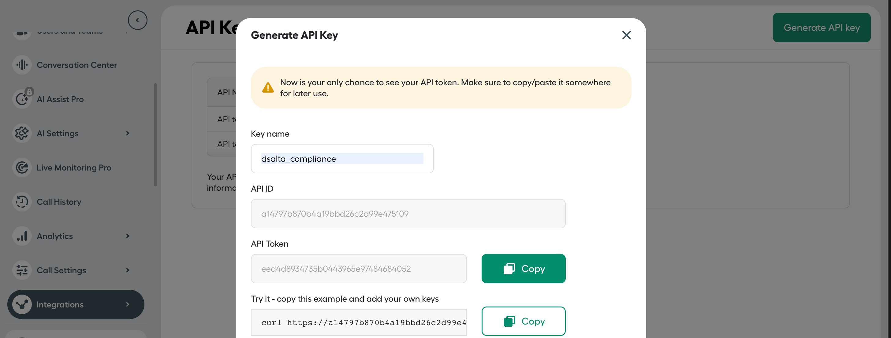 Aircall's Generate API Key dialog showing the key name, API ID and API Token with a copy button