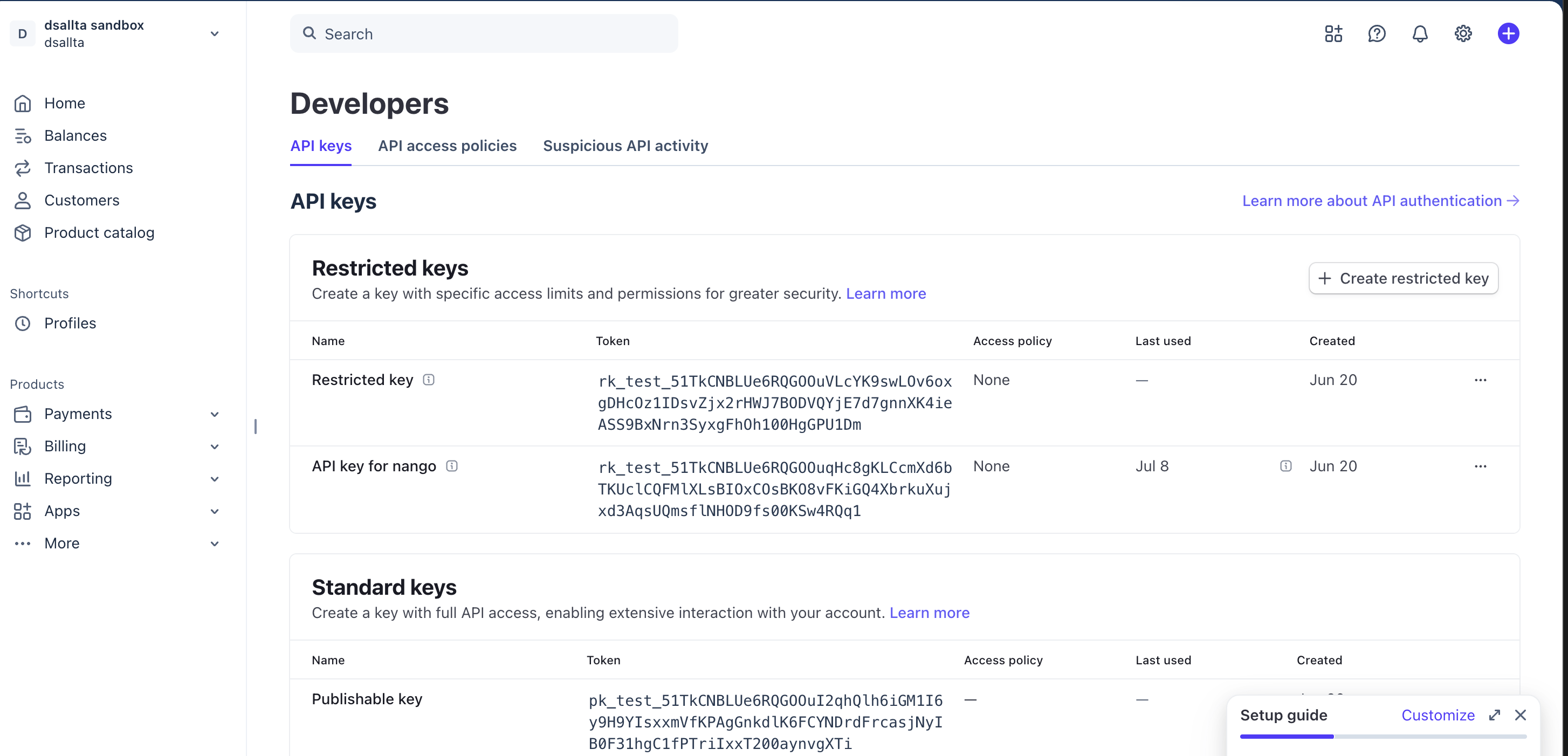 Stripe Developers page on the API keys tab, showing the Restricted keys table with two rk_test keys and the Create restricted key button, plus the Standard keys section below