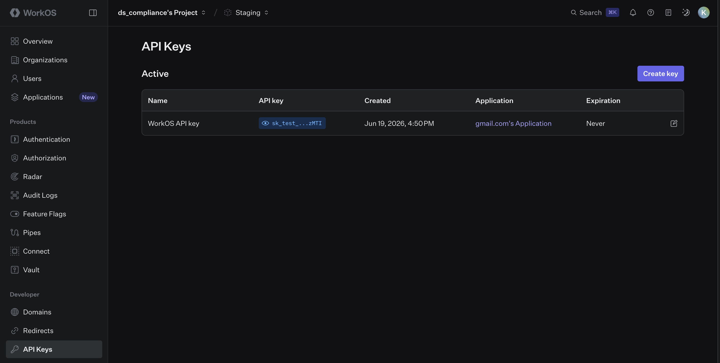 WorkOS Dashboard on the API Keys page listing one active key named WorkOS API key with a masked sk_test value, its creation date and a Create key button
