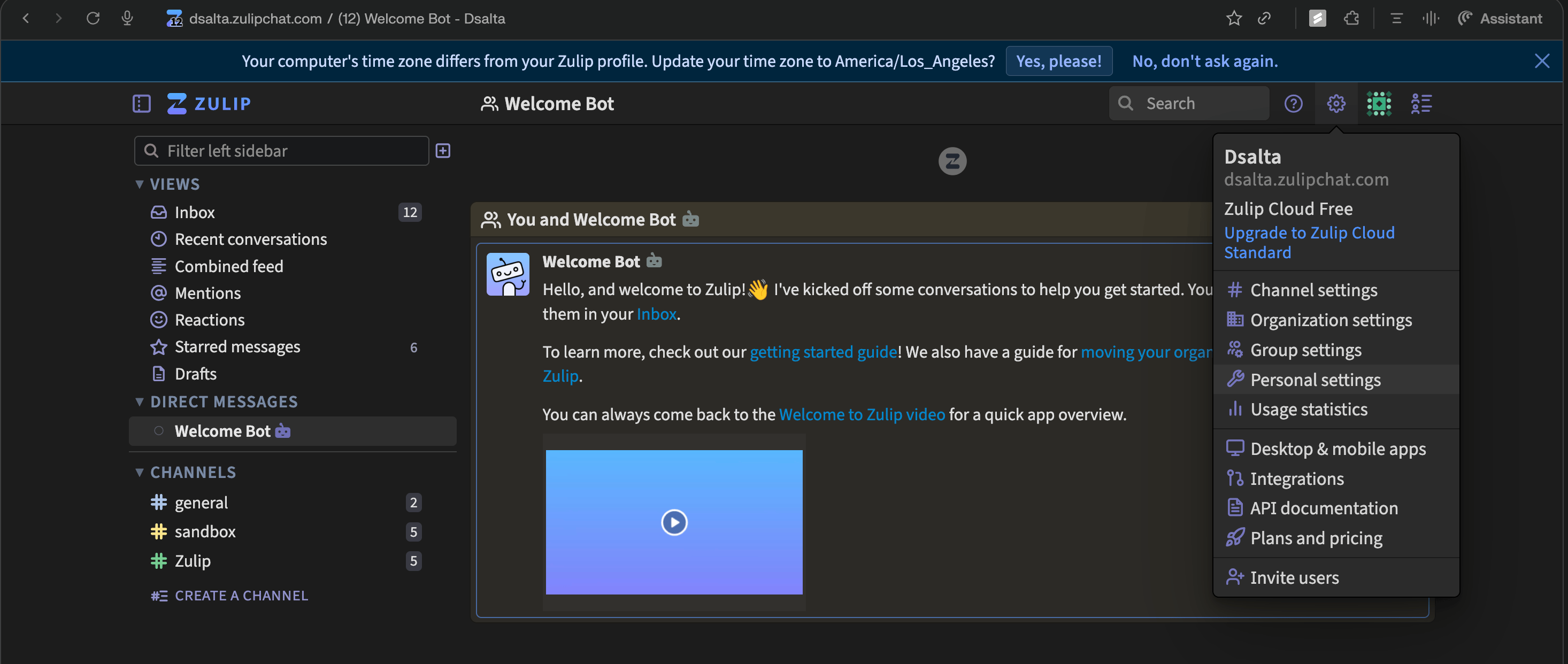 Zulip web app with the gear menu open, showing the Personal settings entry alongside Channel settings, Organization settings and Group settings