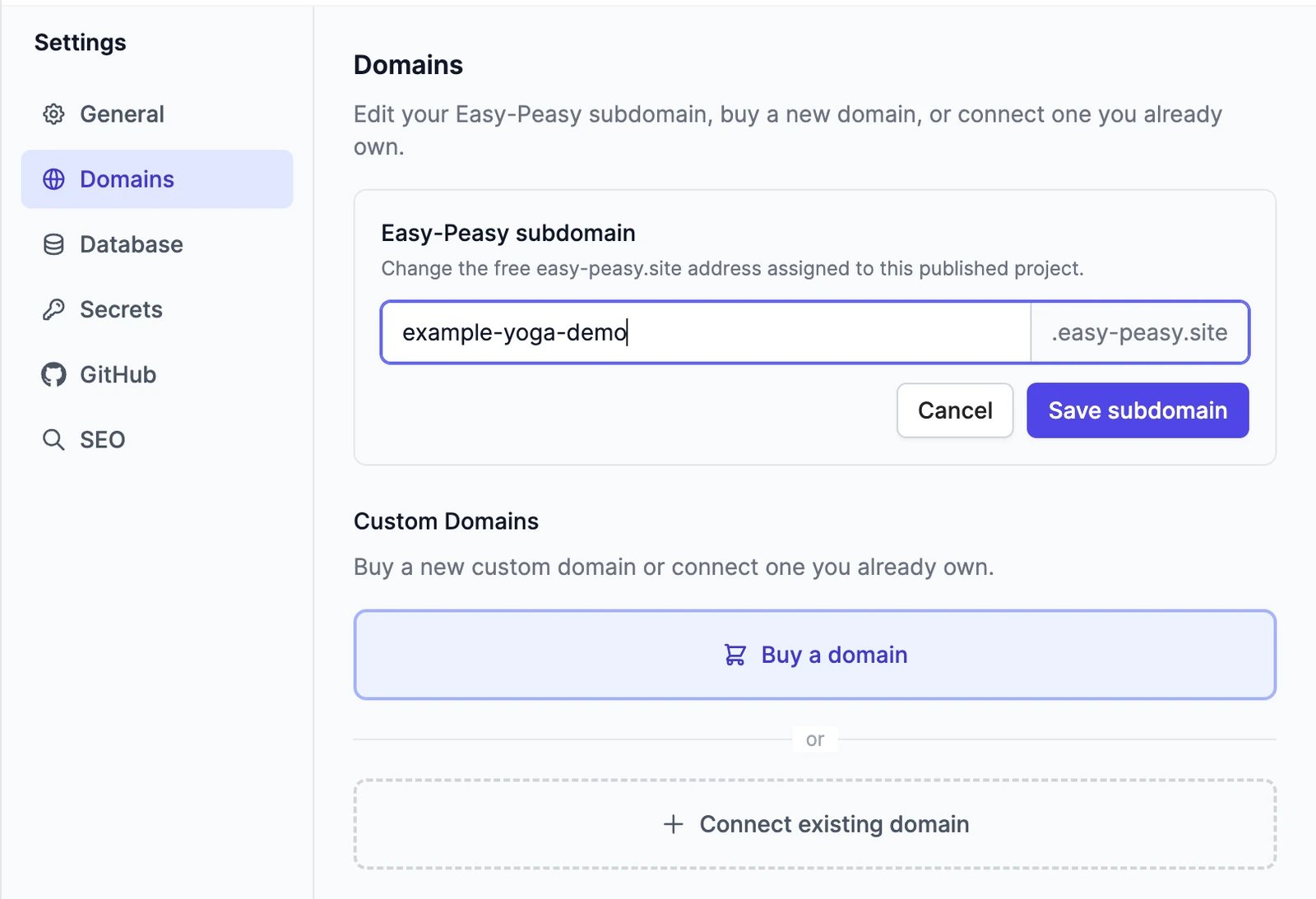 The Domains settings with the Easy-Peasy subdomain being edited to example-yoga-demo, Cancel and Save subdomain buttons, and below them the Custom Domains options Buy a domain and Connect existing domain