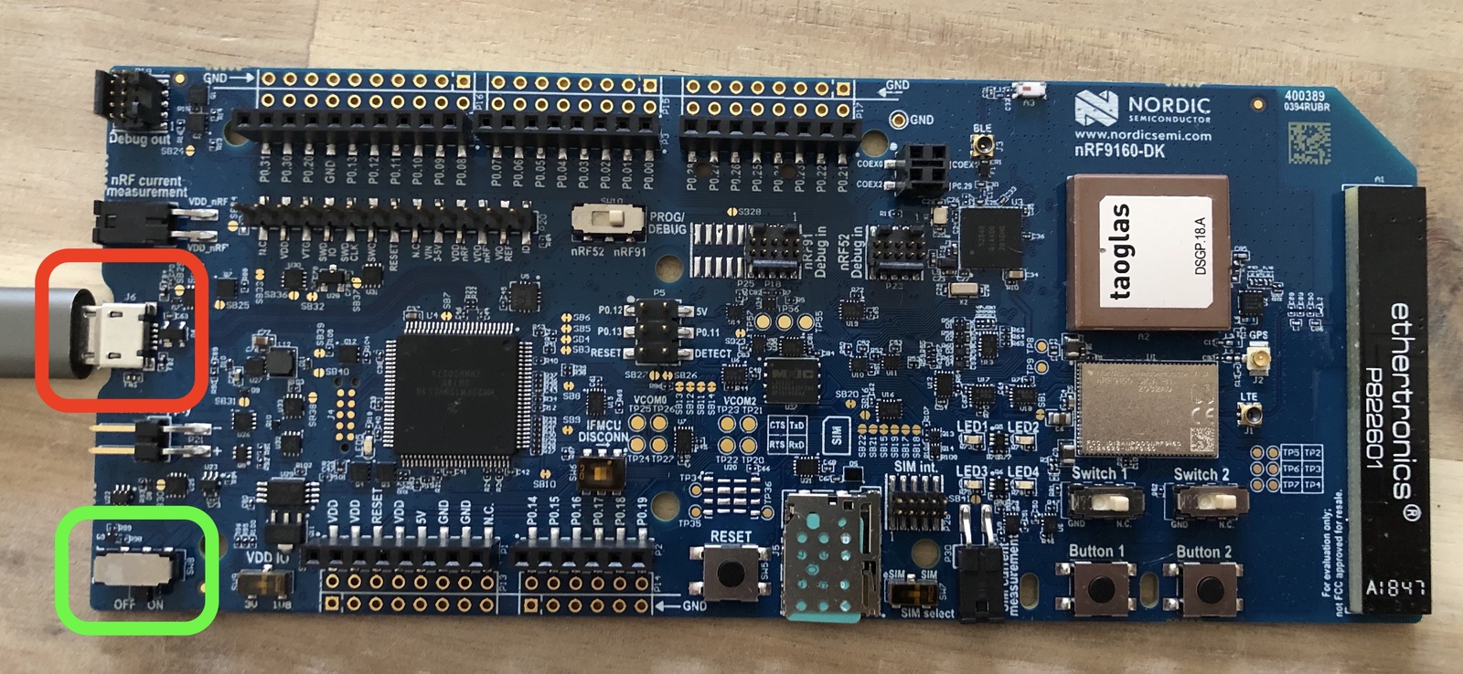 Micro-USB cable connected to the short-side USB port on the nRF9160 DK