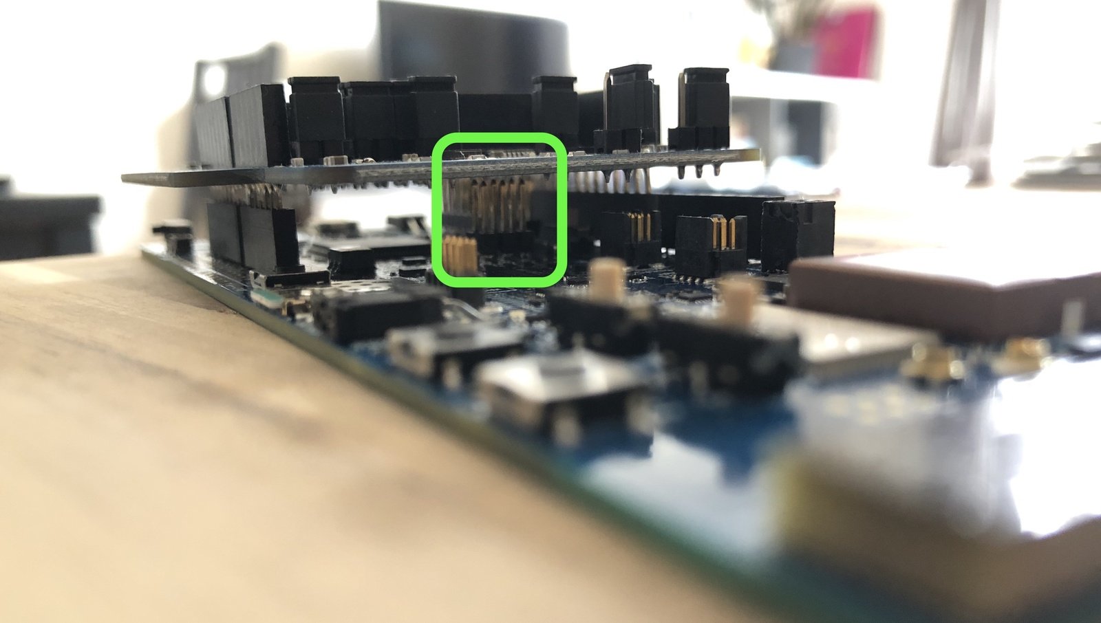 The expansion shield positioned clear of the center pins on the nRF9161 DK