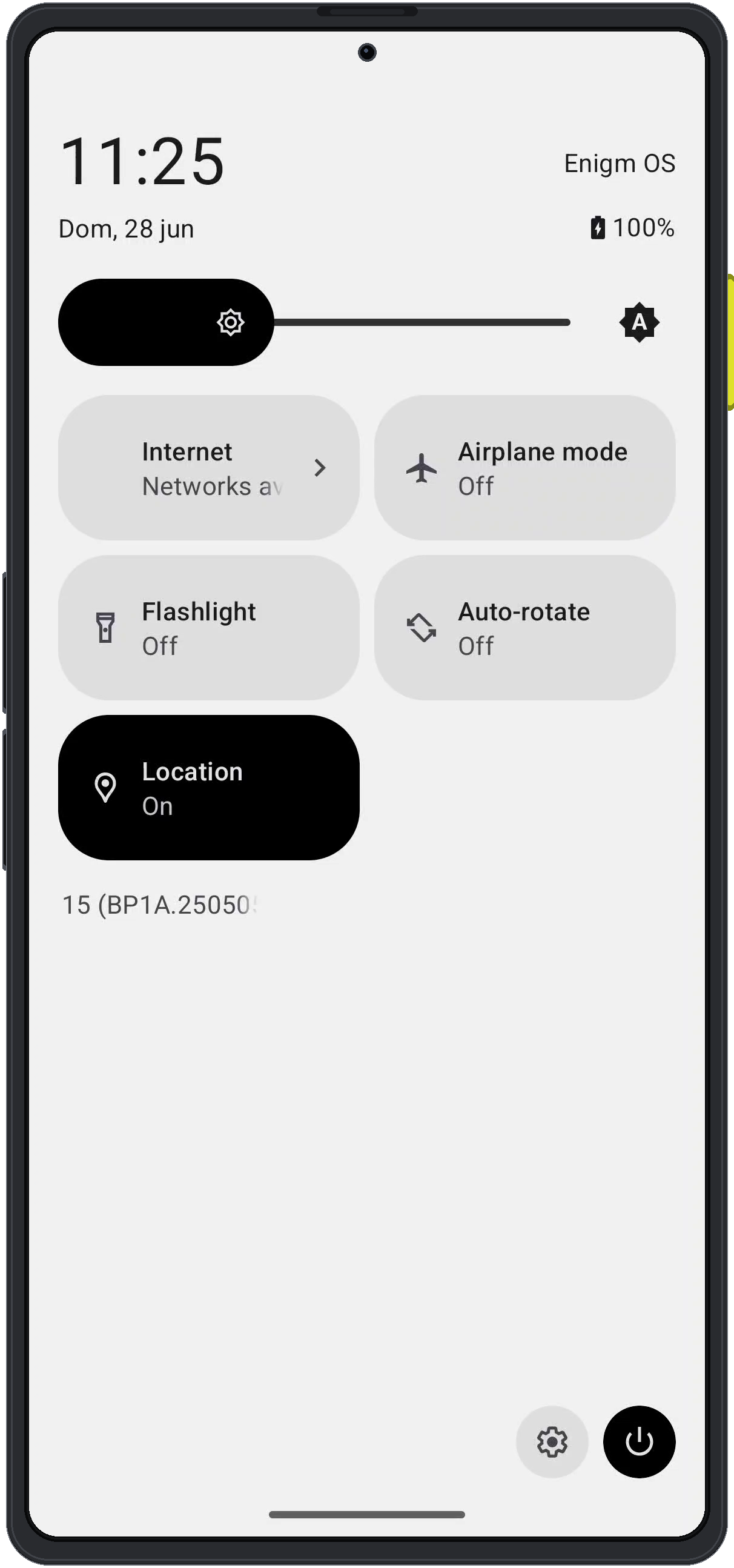 Enigm OS quick settings panel showing the settings button