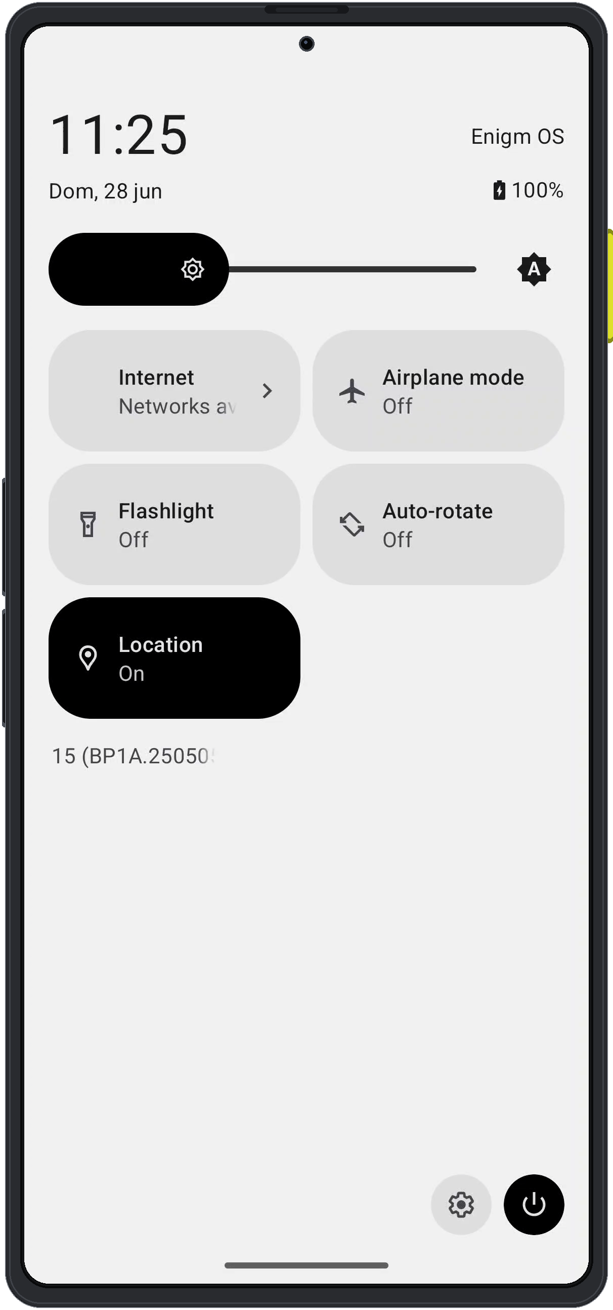 Enigm OS quick settings panel showing the settings button