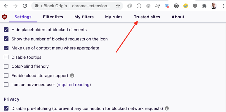 Screenshot showing This will open the uBlock Origin Settings page in Chrome. Inside of the settings page, you'll want to switch to the Trusted Sites tab.