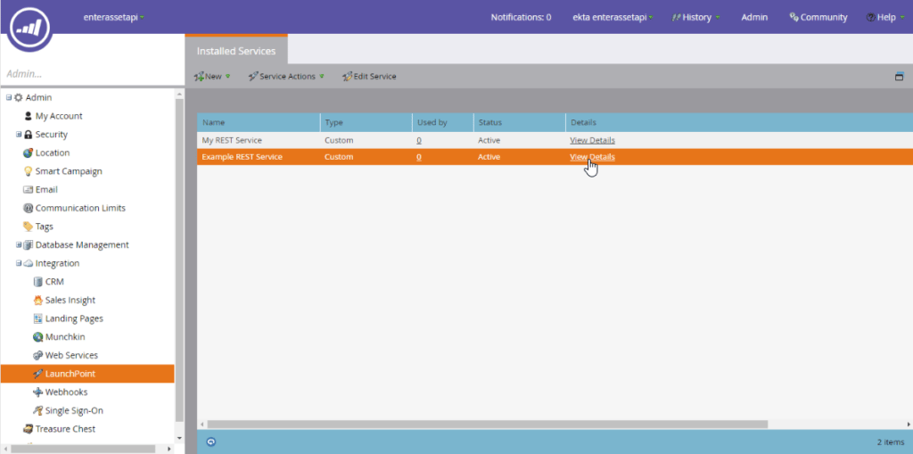 Screenshot showing The Client ID and Client Secret are found in the Admin > LaunchPoint menu by selecting the custom service option, and clicking View Details. A new custom...