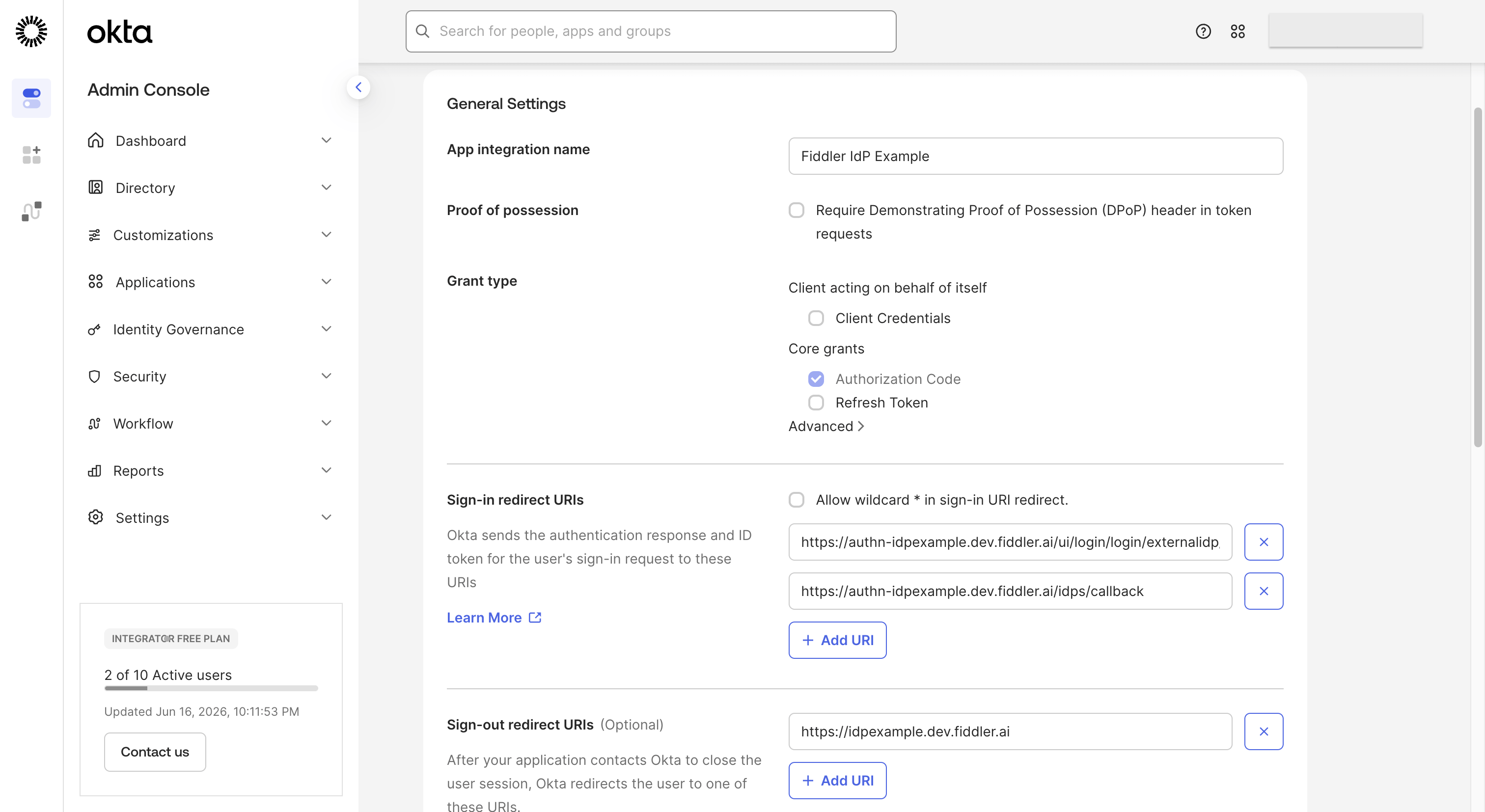 Okta admin console application page with redirect and sign-out URIs