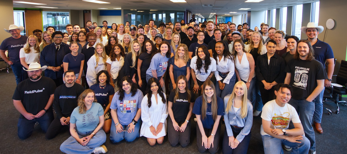 The FieldPulse team gathered for a group photo in the office
