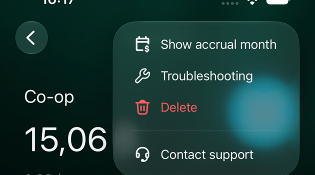 iOS Co-op transaction with the ⋮ menu open: Show accrual month, Troubleshooting, Delete, Contact support.