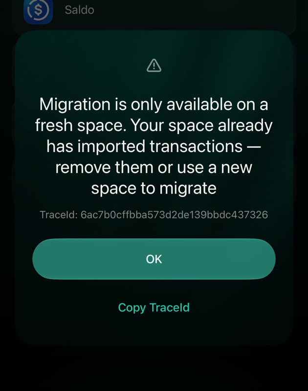 iOS dialog: Migration is only available on a fresh space. Your space already has imported transactions — remove them or use a new space to migrate. OK.