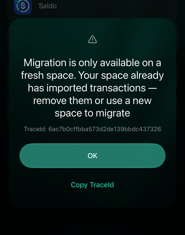 iOS dialog: Migration is only available on a fresh space. Your space already has imported transactions — remove them or use a new space to migrate. OK.