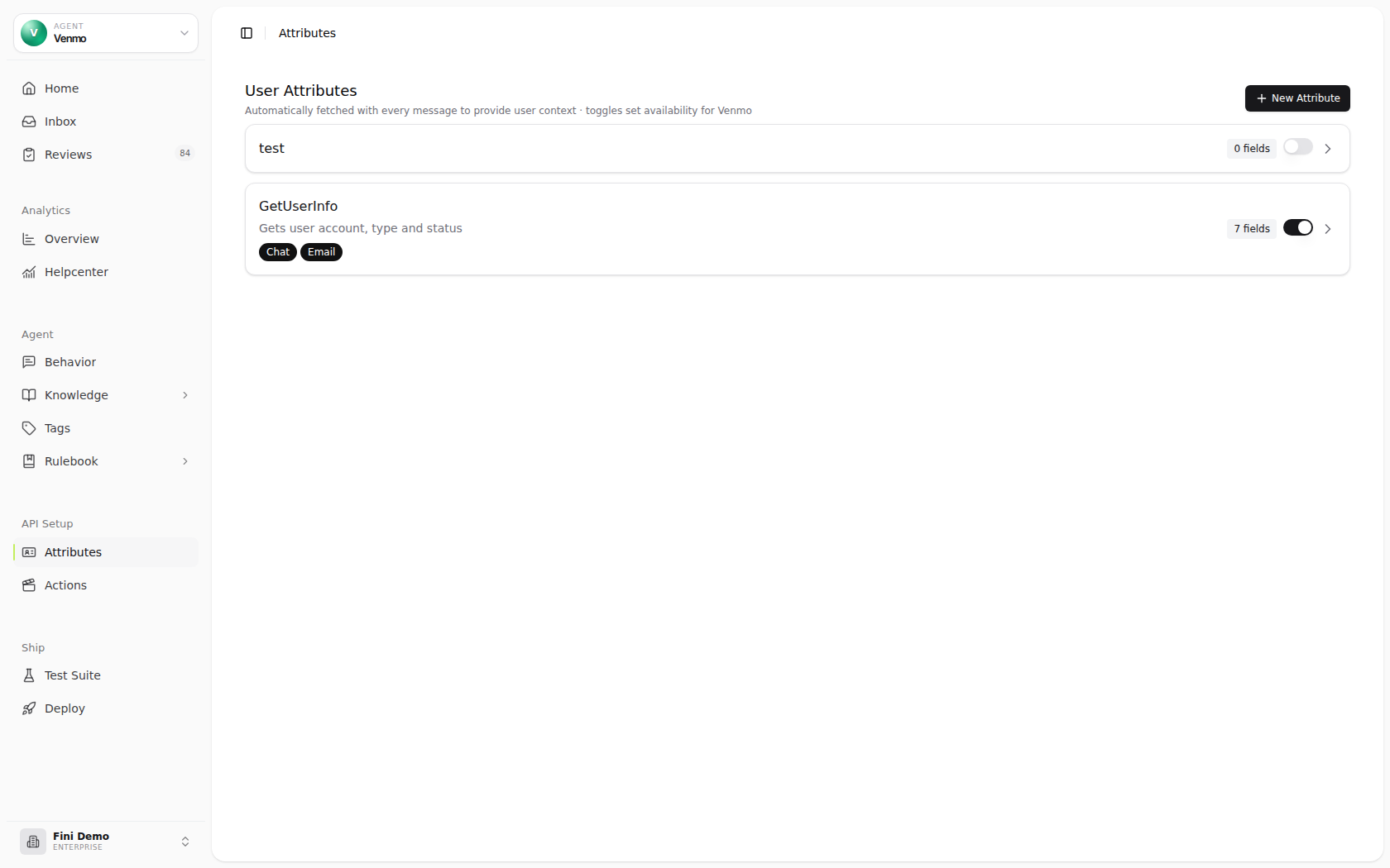 User Attributes page in the Fini Demo workspace showing the selected agent, two configured attributes, field counts, availability toggles, and the New Attribute button