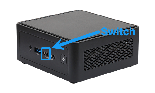 Front of the Model C coordinator, showing the raised section on the lid and, on the front face from left to right, an audio jack, one USB-A port, two USB-C ports, and the power button