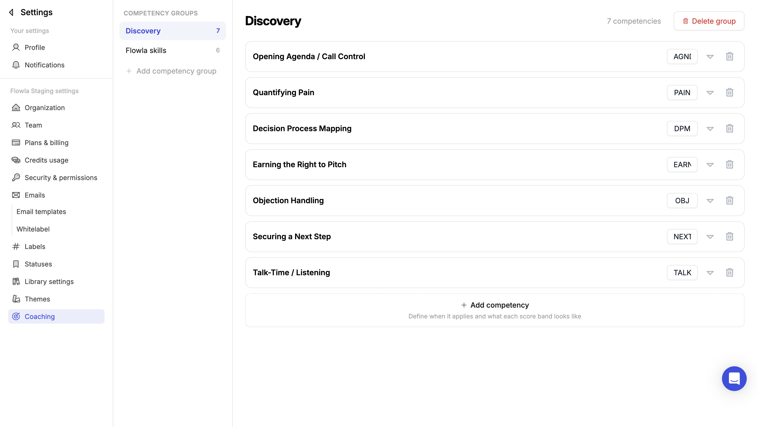 The Coaching settings page showing a Discovery competency group with seven competencies, each with a short code