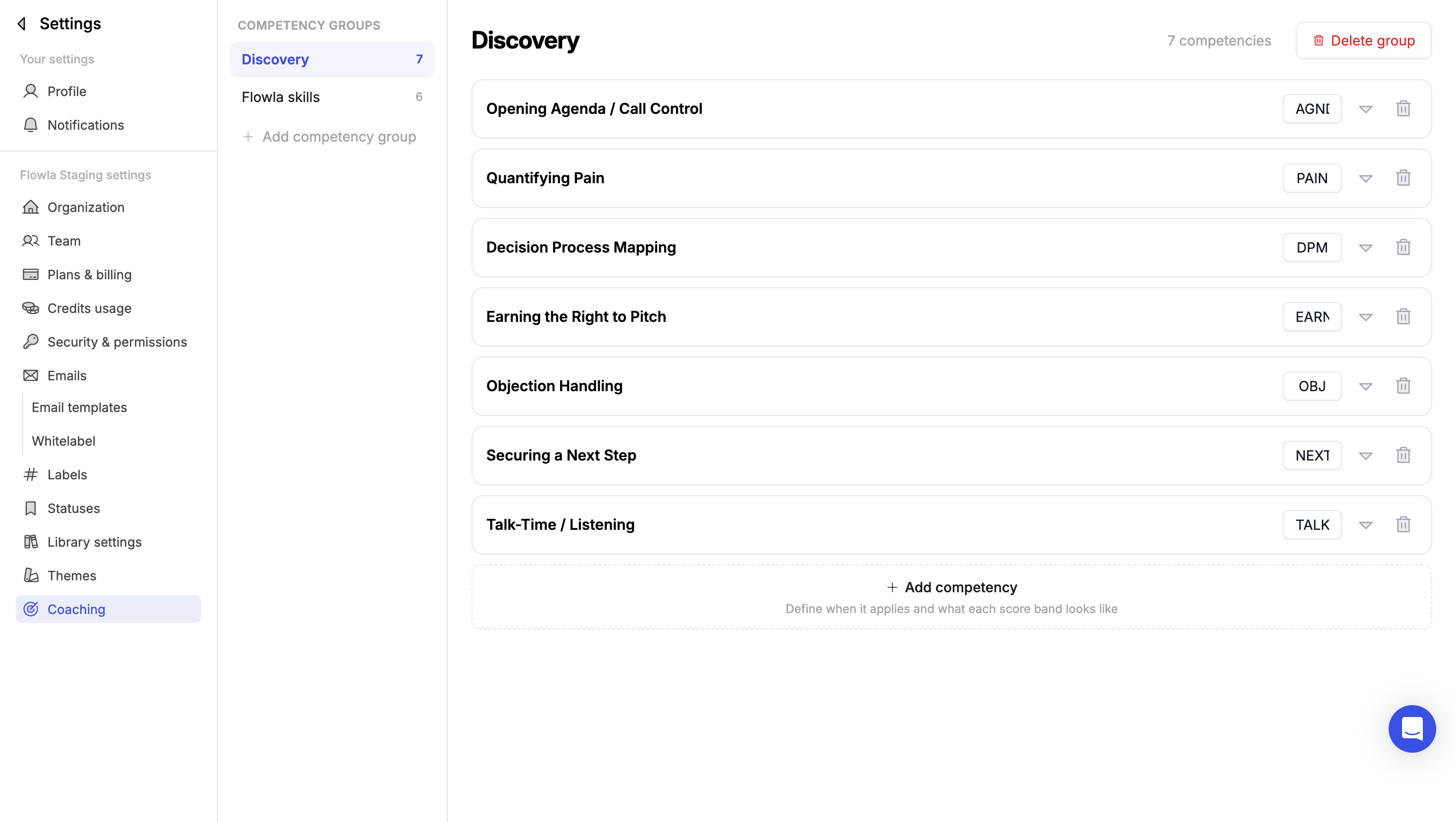 The Coaching settings page showing a Discovery competency group with seven competencies, each with a short code