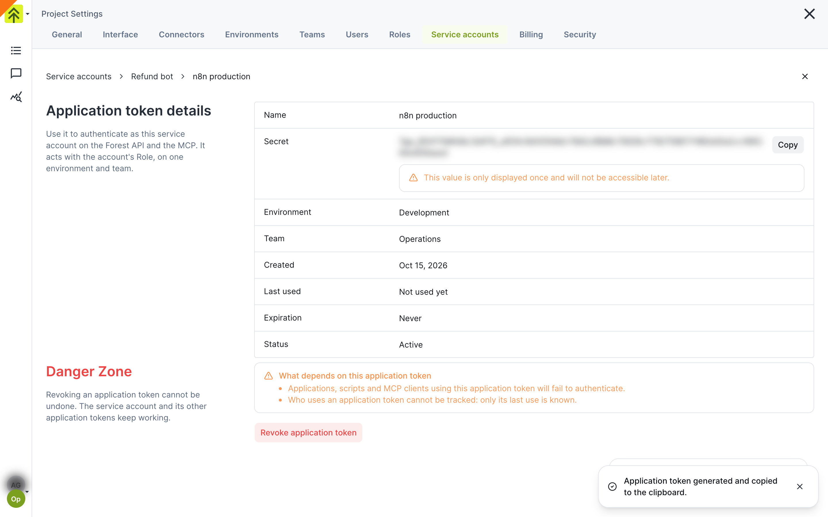 Application token details page with the blurred secret, its Copy button and the only-displayed-once warning