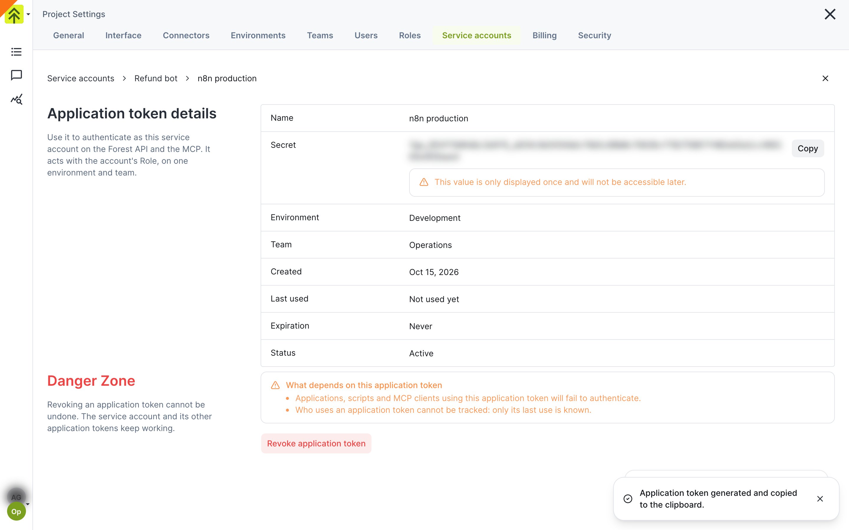 Application token details page with the blurred secret, its Copy button and the only-displayed-once warning