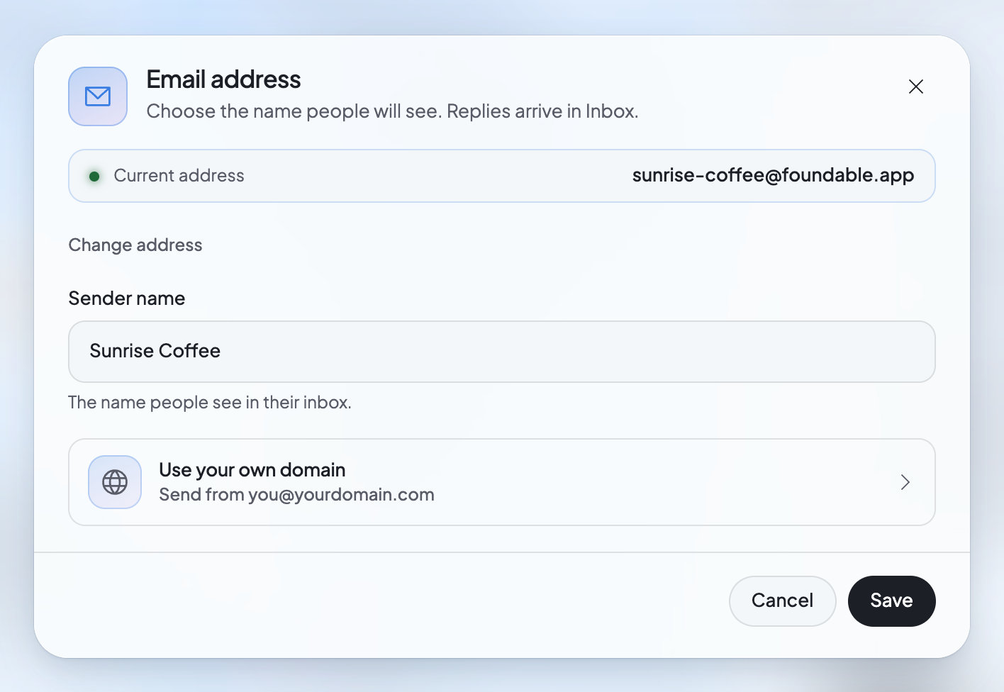 The Email address window: your current address, Change address, the sender name people see, a row to use your own domain, and Save.