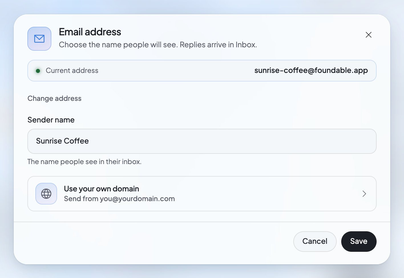 The Email address window: your current address, Change address, the sender name people see, a row to use your own domain, and Save.