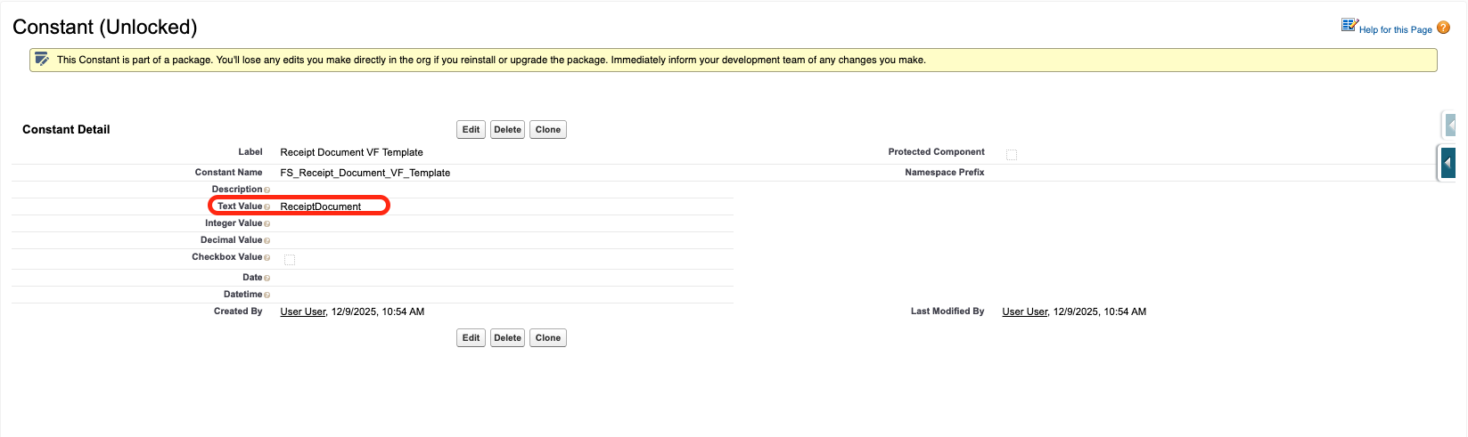 A Constant Custom Metadata record with a Visualforce page name in the Text Value field