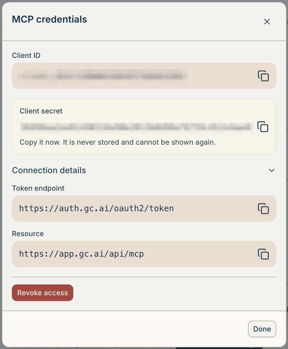 The MCP credentials dialog after generating, showing the client ID, the one-time client secret, and the token endpoint and resource under Connection details