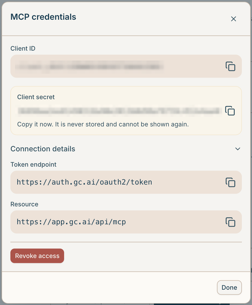 The MCP credentials dialog after generating, showing the client ID, the one-time client secret, and the token endpoint and resource under Connection details