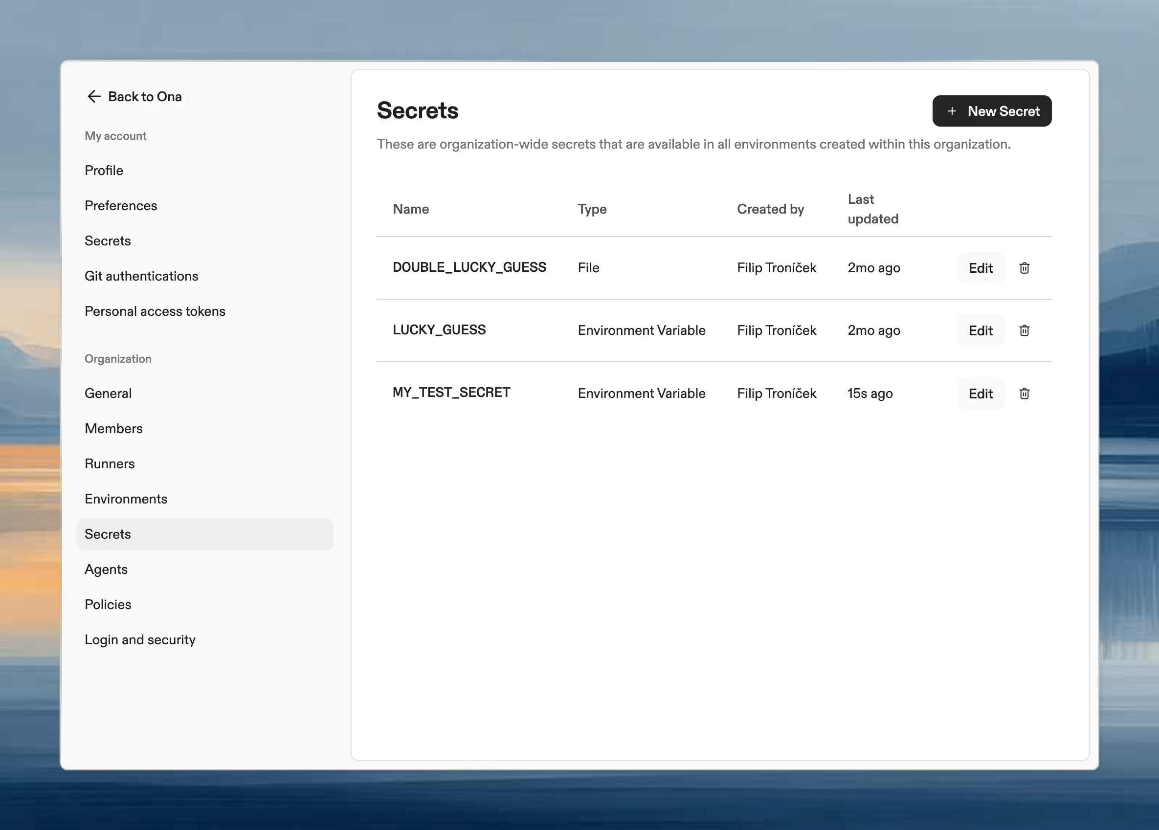 Organization secrets settings page showing list of company-wide secrets with type and name columns