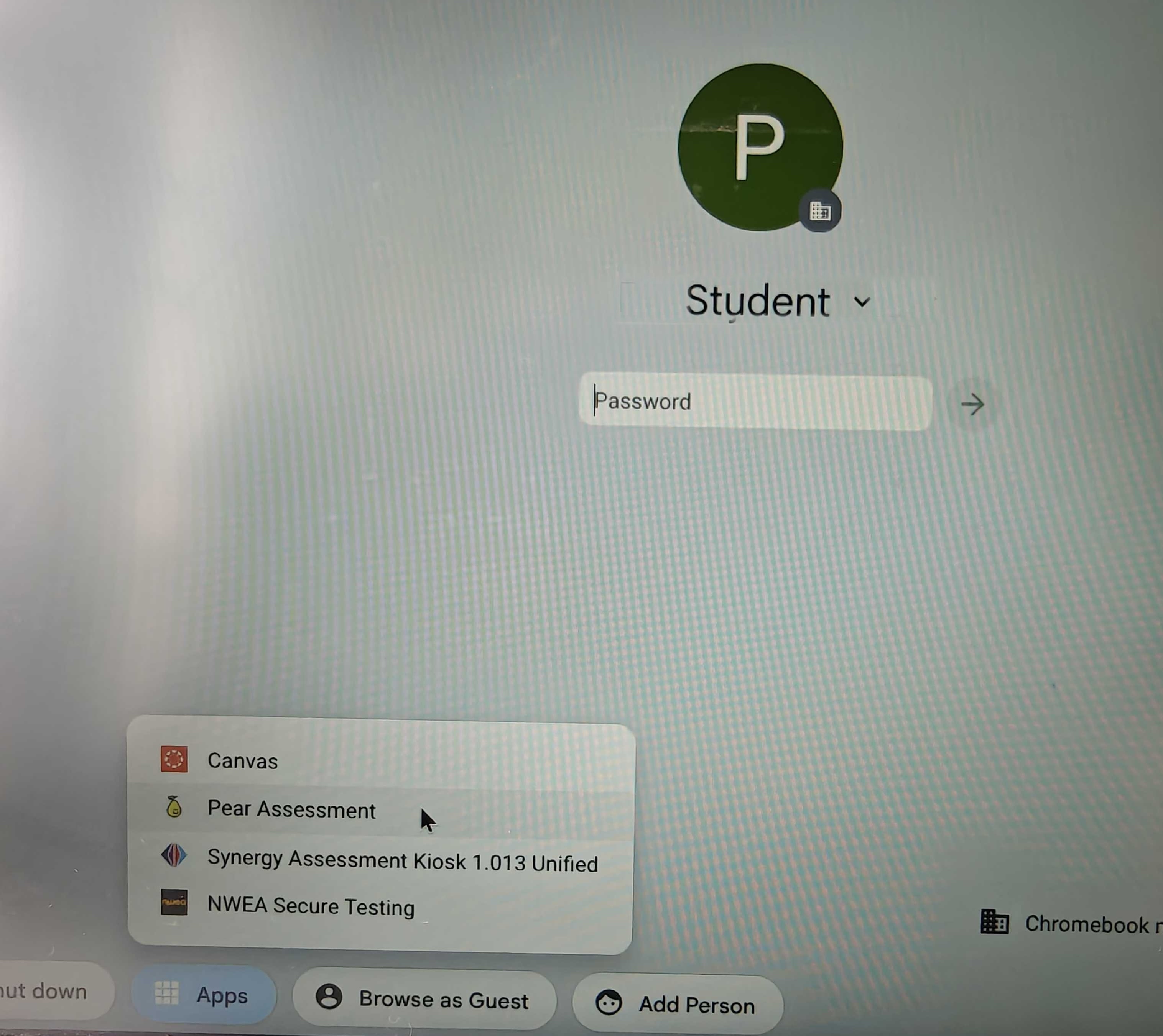 The app tray on the Chromebook sign-in screen, with the Pear Assessment Kiosk app highlighted.
