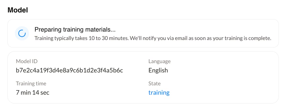 The training status showing Preparing training materials, with the model ID, language, training time, and state