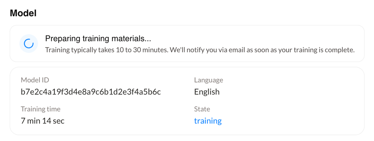The training status showing Preparing training materials, with the model ID, language, training time, and state