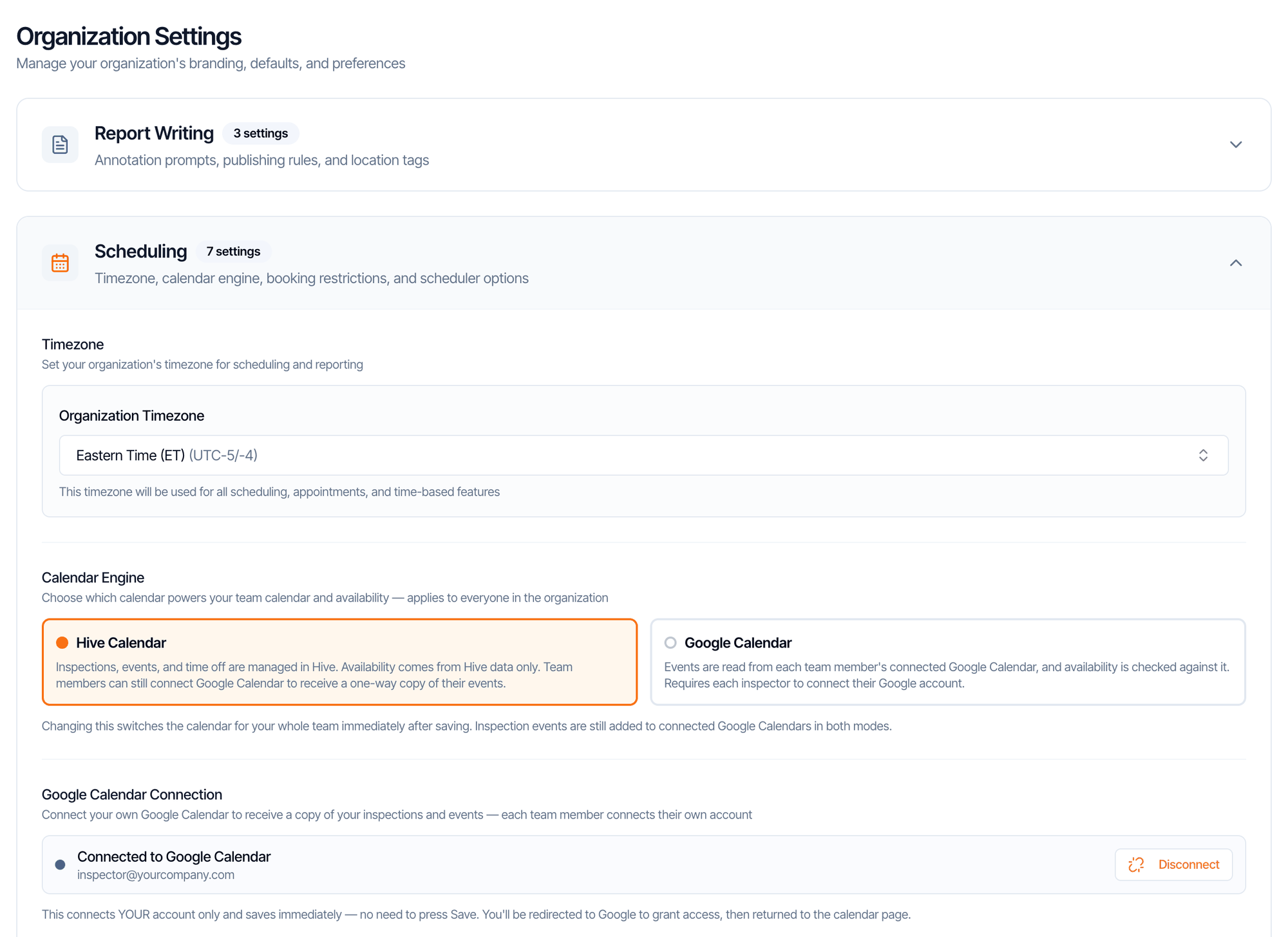 The Organization Settings page with Report Writing collapsed and the Scheduling section open: Timezone, calendar engine, booking restrictions, and scheduler options. It shows Timezone set to Eastern Time (ET), Calendar Engine with Hive Calendar selected and Google Calendar, Google Calendar Connection showing Connected to Google Calendar, inspector@yourcompany.com, and the start of Scheduling Restriction