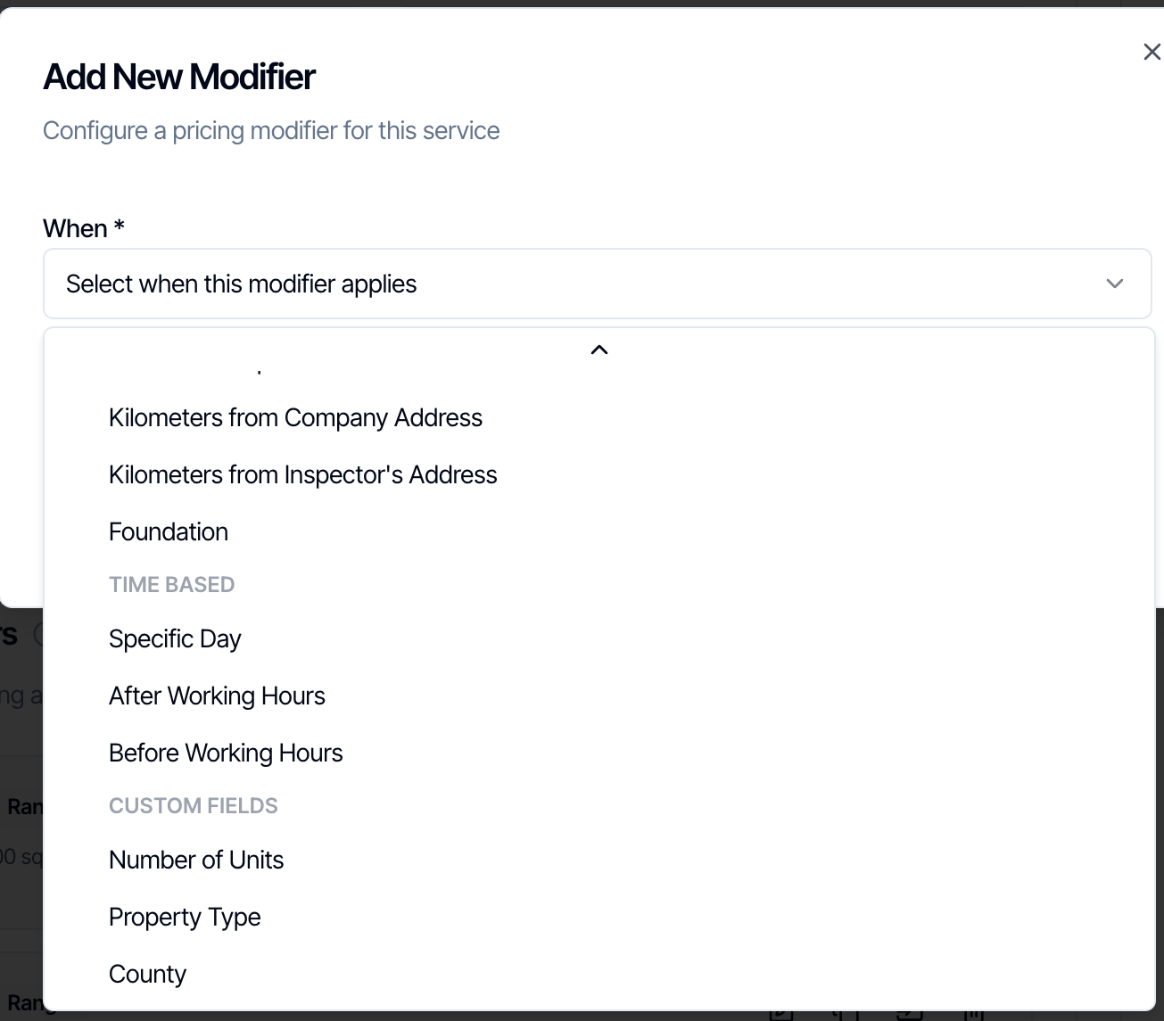 The When list in the Add New Modifier dialog scrolled to the bottom, showing Foundation, the Time Based group (Specific Day, After Working Hours, Before Working Hours) and the Custom Fields group with Number of Units, Property Type and County
