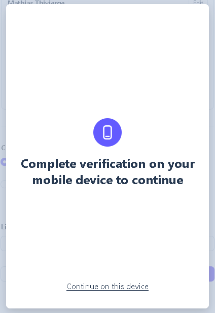 Computer screen waiting while verification is completed on a mobile device