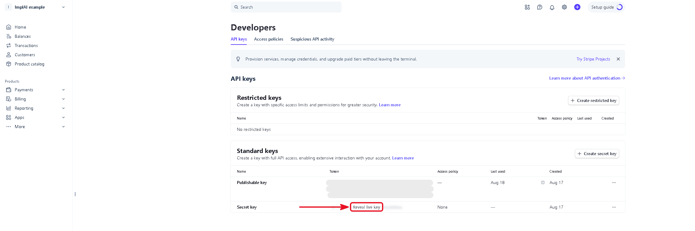 Stripe API keys page with the Reveal live key button on the secret key row
