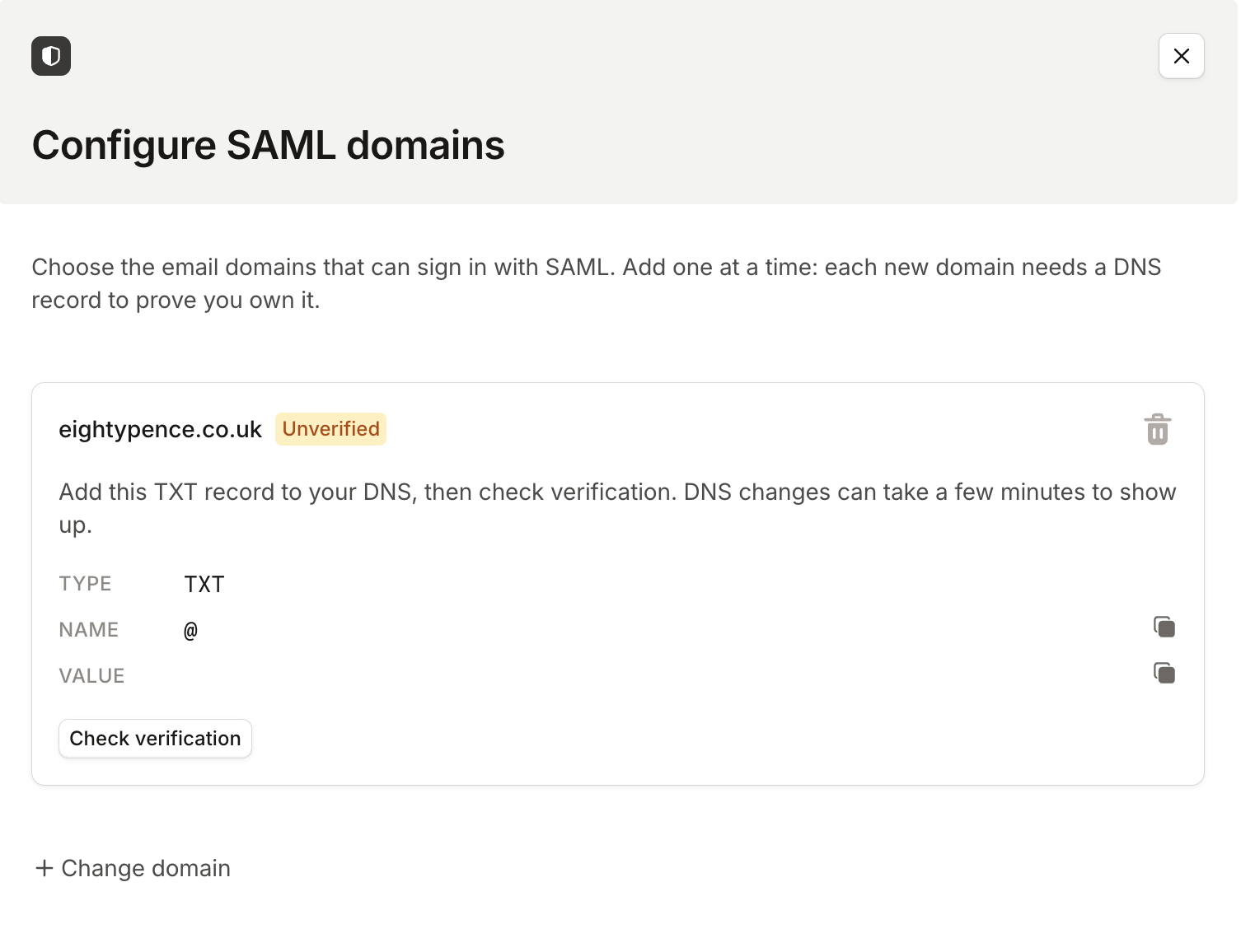 The Configure SAML domains drawer showing an unverified domain with the TXT record to add and a Check verification button