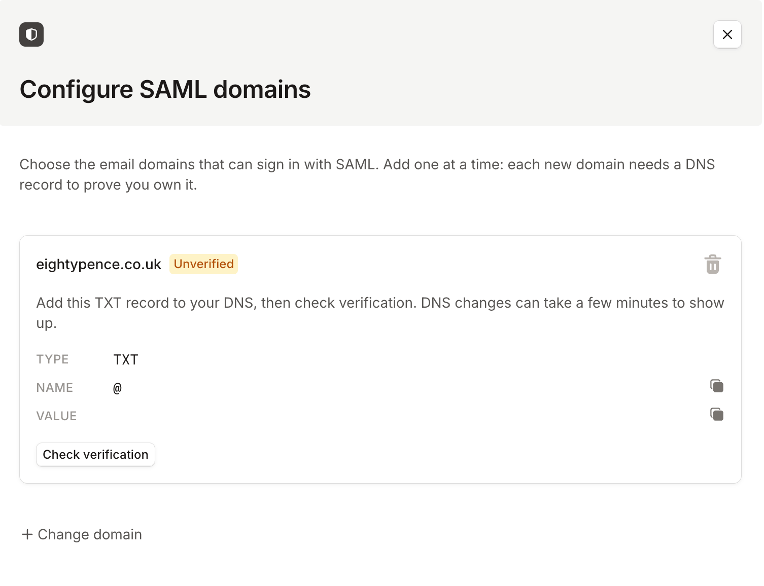 The Configure SAML domains drawer showing an unverified domain with the TXT record to add and a Check verification button
