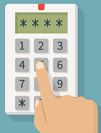 Hand entering a PIN on a numeric keypad