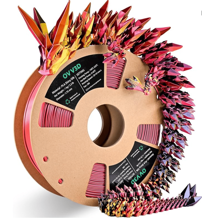 Tri-color silk PLA filament spool with a printed dragon