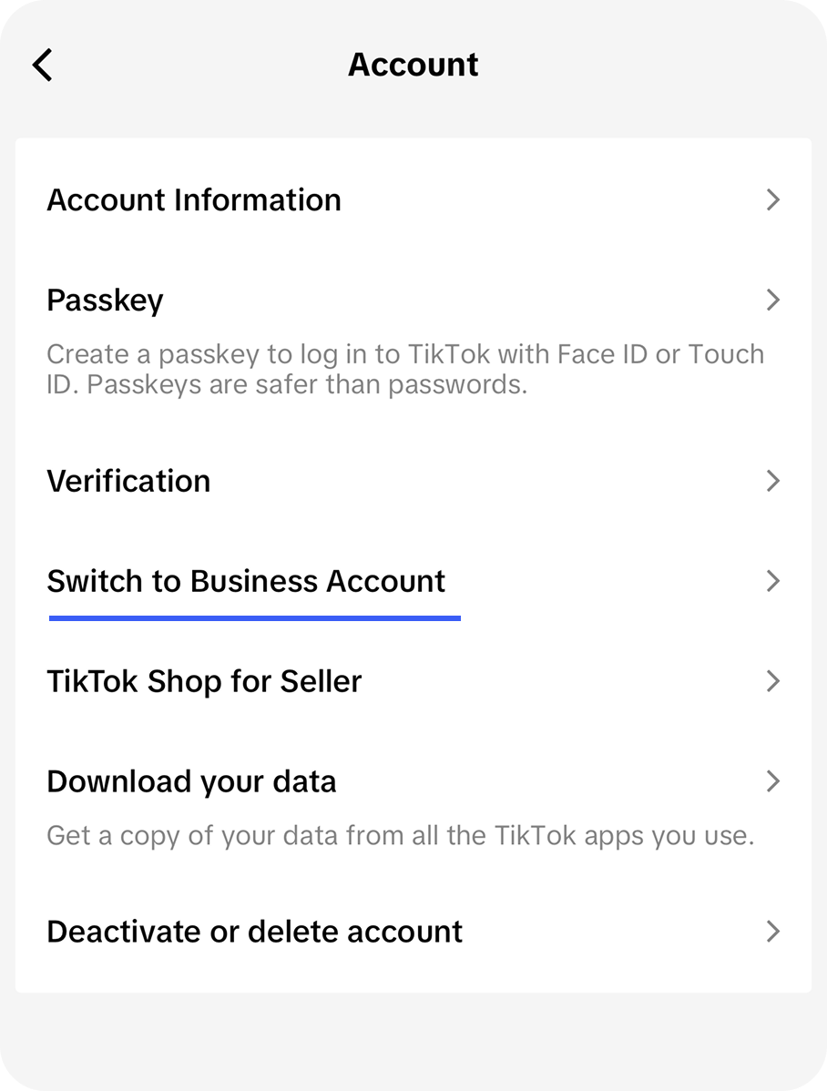 The Account settings screen in the TikTok app with the Switch to Business Account option highlighted
