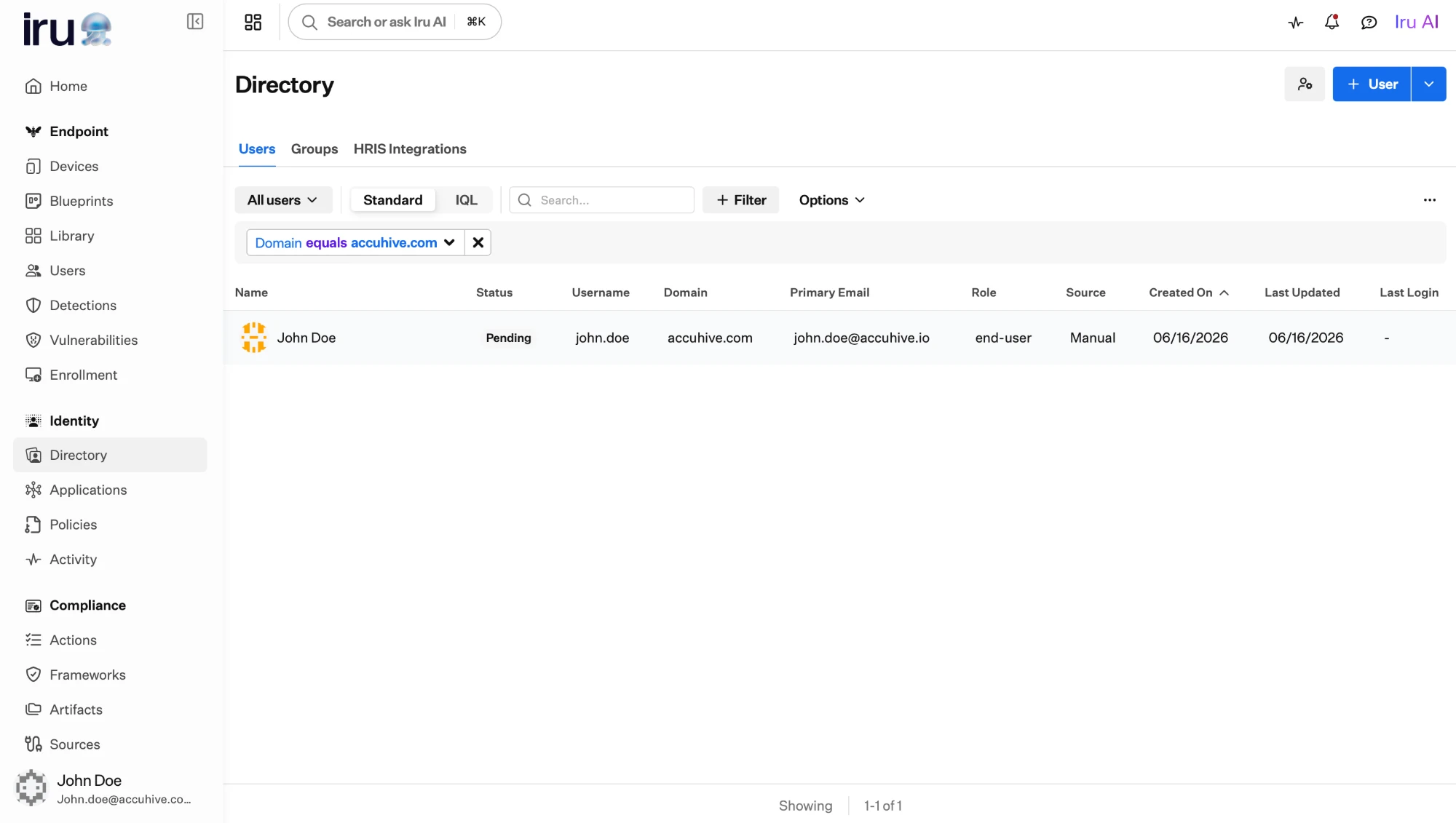 The Users list filtered by Domain equals accuhive.com, shown as a removable filter chip above the list.