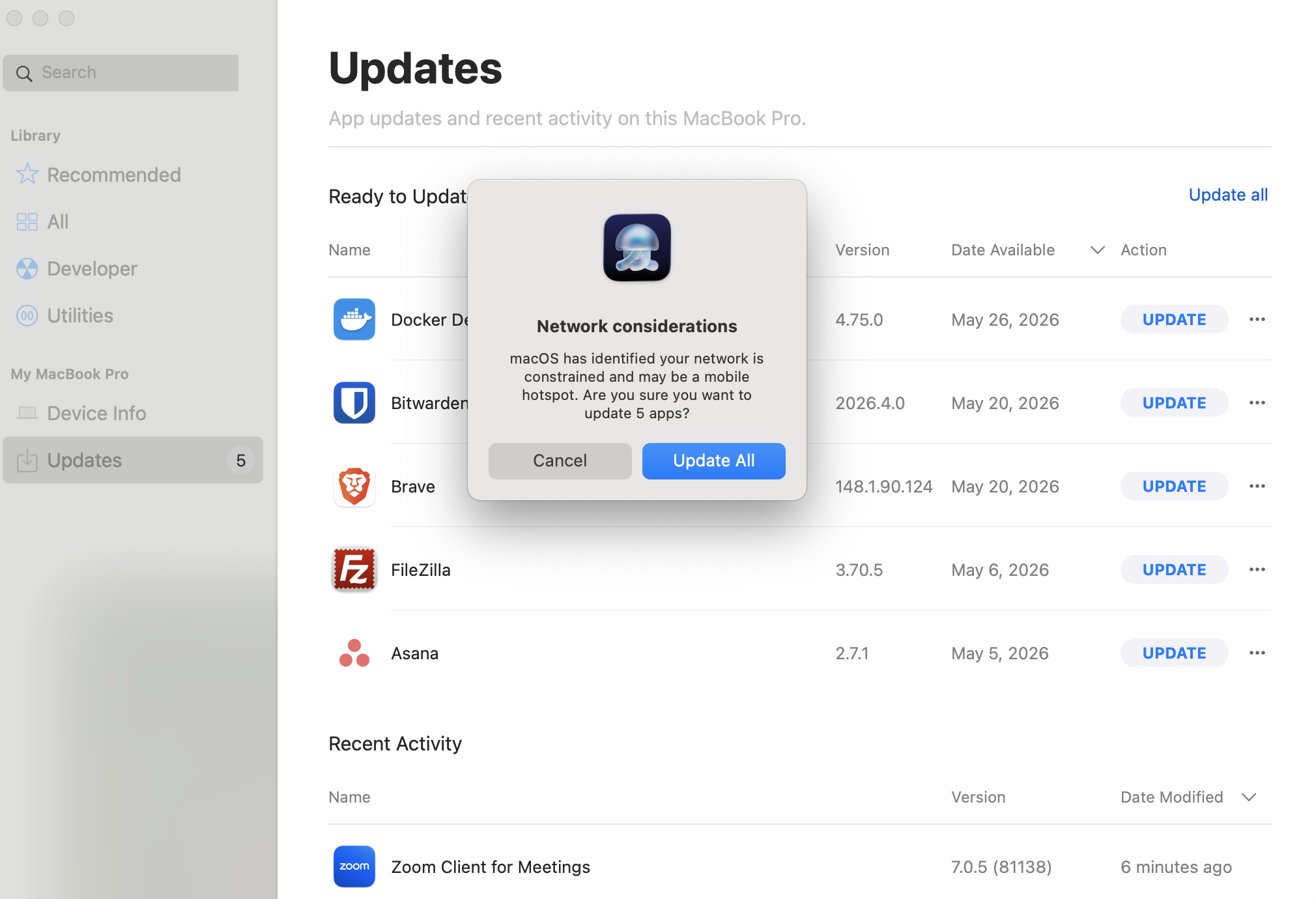 Iru Self Service Updates view with Network considerations dialog warning that macOS identified a constrained network or mobile hotspot before updating apps