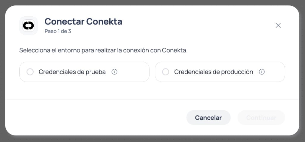 Modal de Brain Studio paso 1 de 3 para elegir credenciales de prueba o credenciales de producción al conectar Conekta
