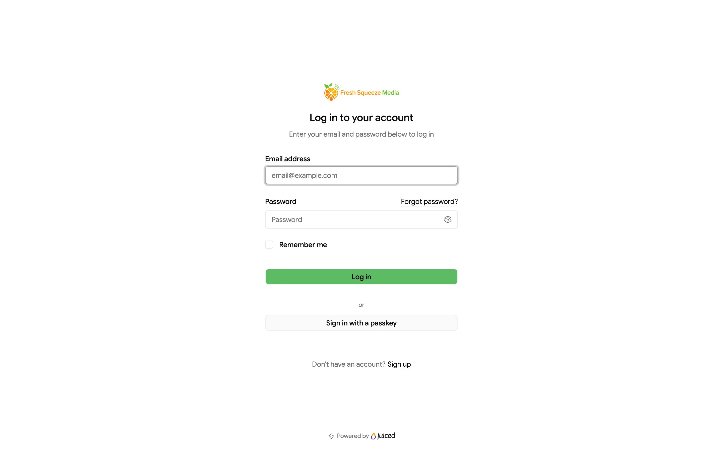 Portal login page with email address and password fields, Remember me, a Log in button, and a Sign in with a passkey button