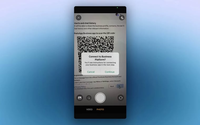 The phone camera view shows the QR code on the Meta pairing screen.